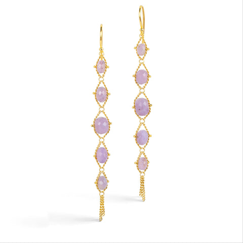 Gold earrings featuring a row of purple Holly Blue Chalcedony stones