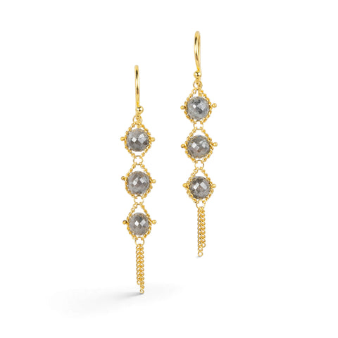 Gold earrings featuring trios of shimmering grey diamonds, shown against a white background.
