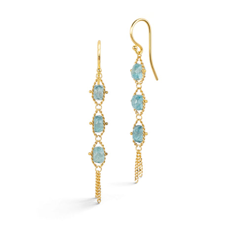 Gold earrings featuring trios of kyanite beads, shown against a white background.
