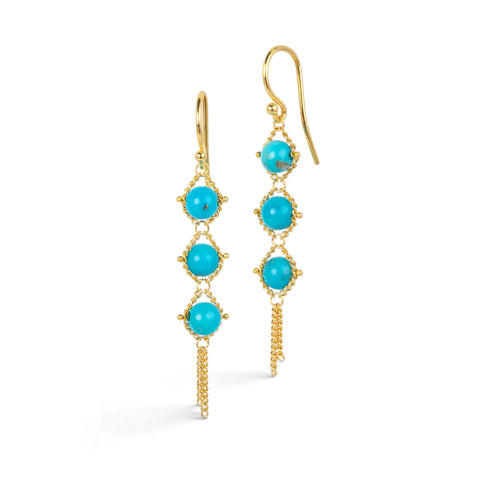 Gold earrings featuring trios of sleeping beauty turquoise gemstones, shown against a white background.