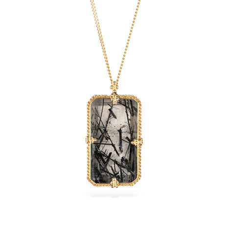 Handmade 18k yellow gold necklace with a tourmalated quartz pendant on a white background