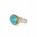 Handmade fine jewelry turquoise ring with an 18k gold bezel and sterling silver band