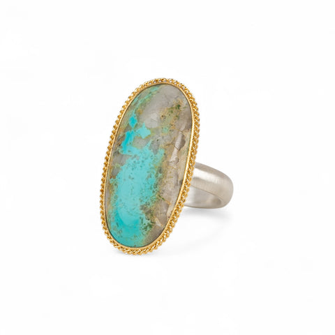 Handmade fine jewelry turquoise ring with an 18k gold bezel and sterling silver band