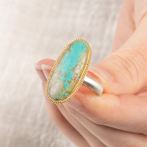Handmade fine jewelry turquoise ring with an 18k gold bezel and sterling silver band