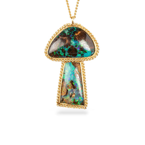 Gold mushroom pendant with boulder opal stones on a white background