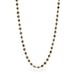 Gold necklace with black diamonds on a white background
