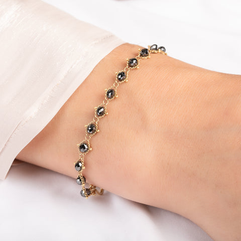 Bracelet with black diamonds on a person