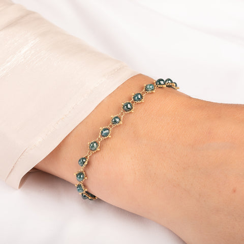 Bracelet with blue diamonds on a person