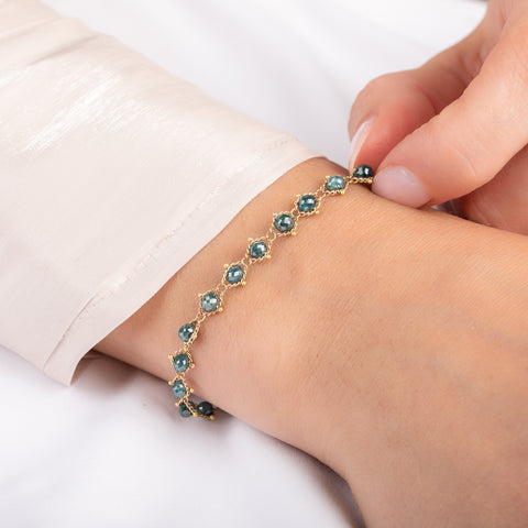Bracelet with blue diamonds on a person
