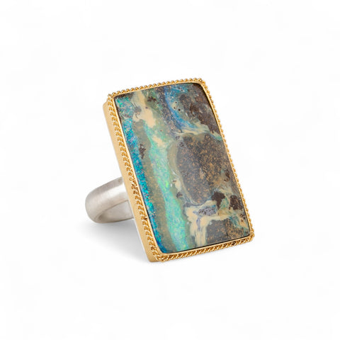 Boulder opal ring in 18k gold bezel and sterling silver band