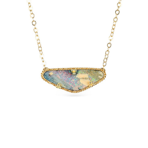 Boulder opal necklace with gold chain on a white background