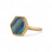Gold ring with a hexagonal boulder opal stone on a white background