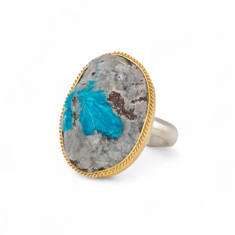 Handmade fine jewelry ring with a cavansite crystal stone set in an 18k gold bezel with a sterling silver band