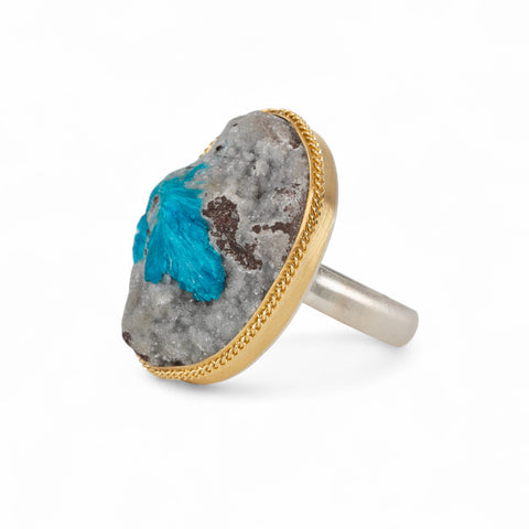 Handmade fine jewelry ring with a cavansite crystal stone set in an 18k gold bezel with a sterling silver band