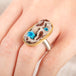 Handcrafted ring with a cavansite quartz gemstone, 18k gold bezel and sterling silver band