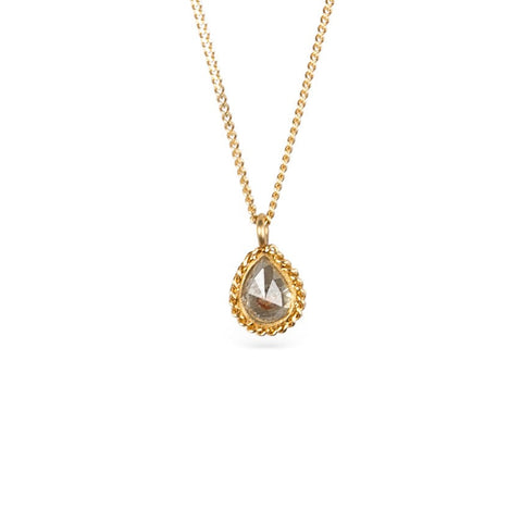 Gold necklace with a natural-colored diamond on a white background