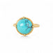 Gold ring with a turquoise stone on a white background