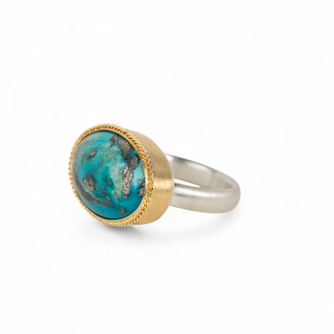 Handmade fine jewelry turquoise ring with an 18k gold bezel and sterling silver band