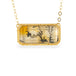 Gold necklace with a rectangular pendant featuring a dendritic quartz with a nature design on a white background