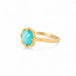 Gold ring with an Ethiopian opal stone on a white background