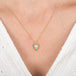 Ethiopian Opal necklace in gold frame on persons neck