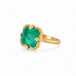Gold ring with an emerald gemstone on a white background