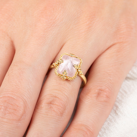 Gold ring with a morganite stone on a person's hand