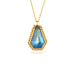 Gold necklace with a moonstone pendant on a white background