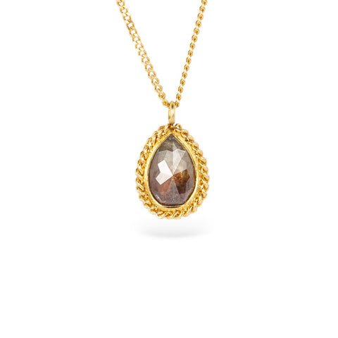 Gold necklace with brown diamond stone on a white background