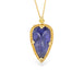 Indigo tanzanite teardrop-shaped gemstone pendant on a gold chain against a white background