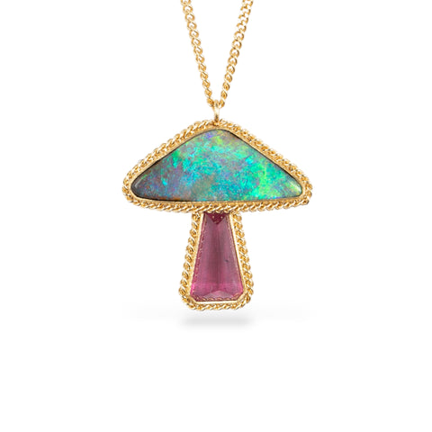 Gold mushroom necklace with a tourmaline and boulder opal stone on a white background