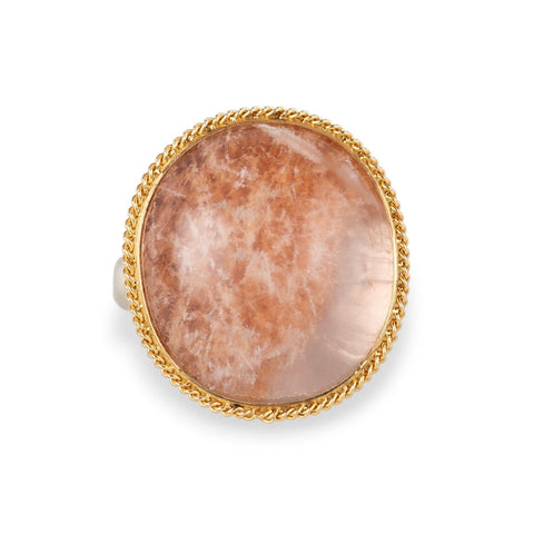 Ring with gold bezel, silver band and lodolite stone on a white background