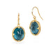 Gold earrings with london blue topaz gemstones on a white background