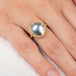 Gold ring with a mabe pearl on a hand