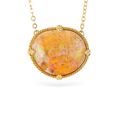 Gold necklace with a large Mexican opal stone on a white background