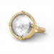 Ring with gold band and gray topaz stone on a white background