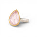 Gold and silver ring with pink morganite teardrop-shaped gemstone on a white background