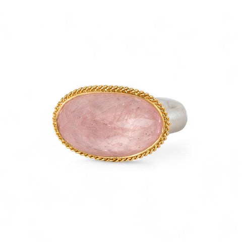 Ring with morganite stone, gold bezel and silver band on a white background