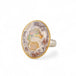 Handmade ring with a Mexican Opal stone set in an 18k gold bezel with a sterling silver band