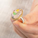 Handmade ring with a Mexican Opal stone set in an 18k gold bezel with a sterling silver band