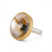 A handcrafted ring with rutilated quartz set in an 18k gold bezel, with a sterling silver band