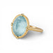 Gold ring with a blue aquamarine gemstone on a white background