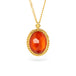 Gold necklace with an orange fire opal gemstone pendant on a white background