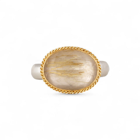 Ring with rutilated quartz stone with an 18k gold bezel and sterling silver band