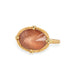 Gold ring with an Oregon sunstone on a white background