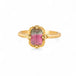 Gold ring with a watermelon tourmaline gemstone on a white background