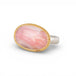 Ring with gold bezel, silver band and pink opal stone on a white background