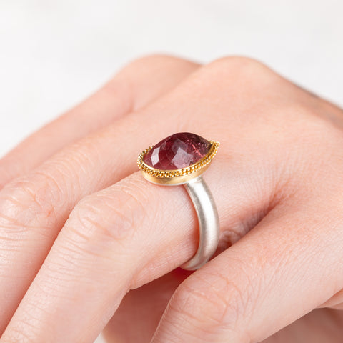 Pink tourmaline ring with gold bezel and silver band