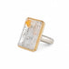 Handmade fine jewelry ring featuring a pyrite in quartz gemstone with an 18k gold bezel and sterling silver band