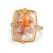 Ring with a gold band and a colorful quartz with pyrite stone on a white background